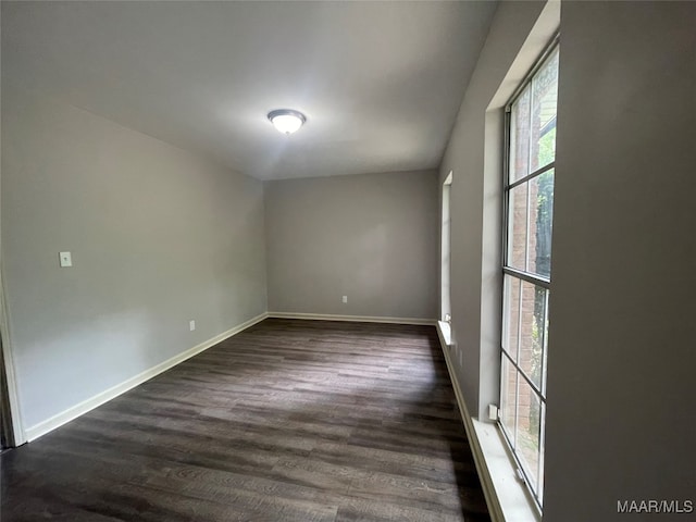 empty room featuring dark hardwood / wood-style floors