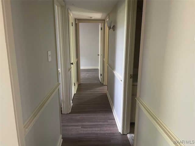 corridor with dark wood-type flooring