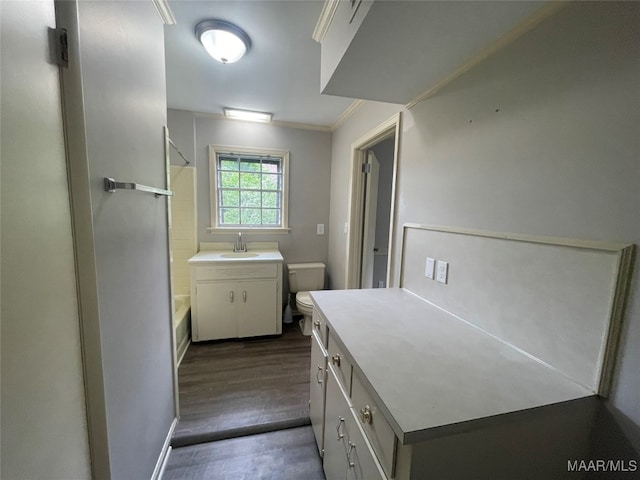 full bathroom with hardwood / wood-style flooring, crown molding, toilet, shower / bath combination, and vanity