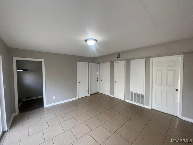 unfurnished bedroom featuring light tile patterned floors