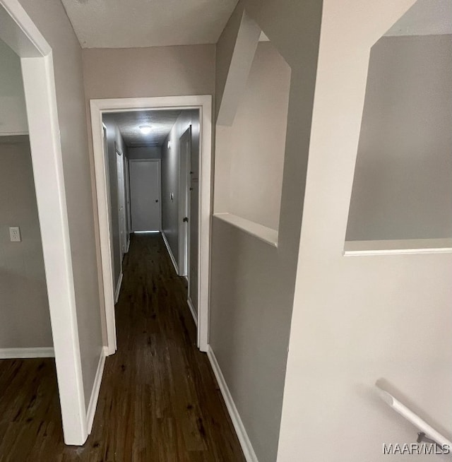 hallway with dark wood-type flooring