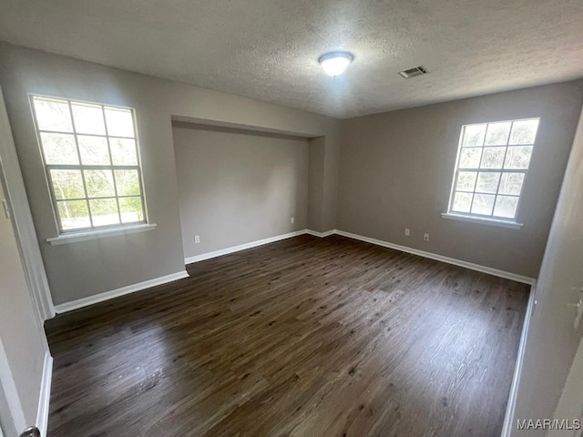 14 Azaleawood Dr, Wetumpka, AL 36093 - unfurnished room with a textured ceiling, dark wood-style flooring, and baseboards