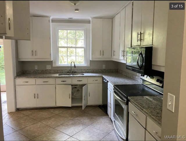 kitchen with black appliances, white cabinetry, and sink