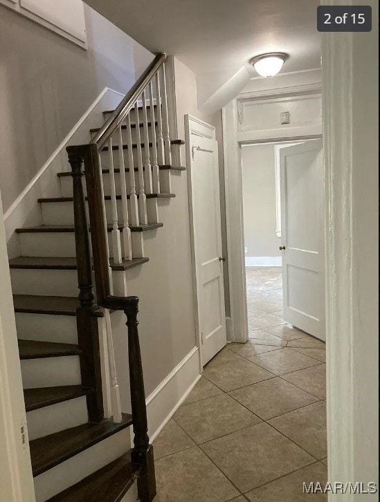 stairs with tile patterned flooring