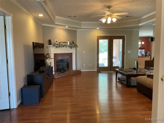 living room with ceiling fan, dark hardwood / wood-style floors, and ornamental molding