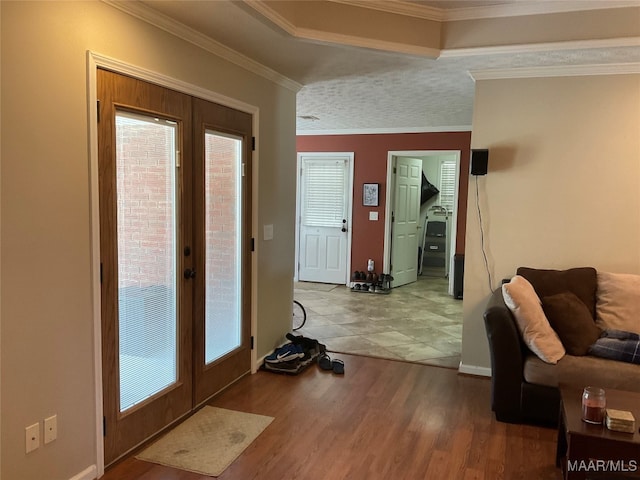 interior space with crown molding, french doors, and wood-type flooring