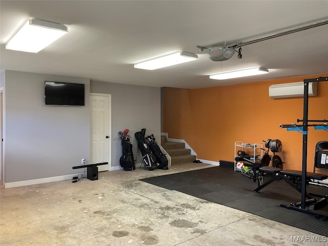 interior space with a wall mounted AC and a garage door opener