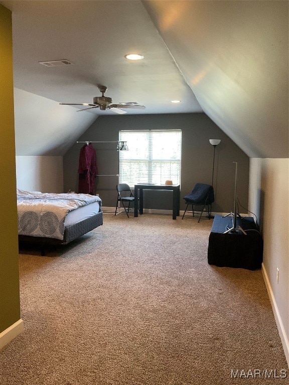 carpeted bedroom featuring lofted ceiling and ceiling fan