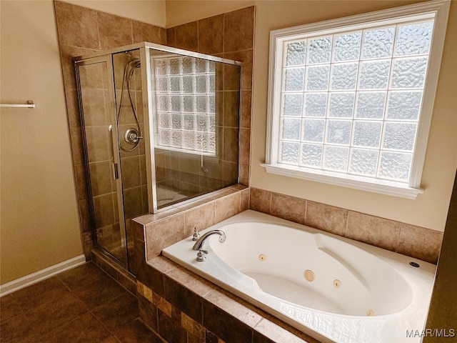 bathroom featuring tile patterned floors and shower with separate bathtub