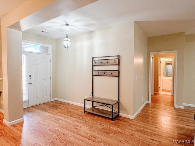 foyer entrance with light hardwood / wood-style floors