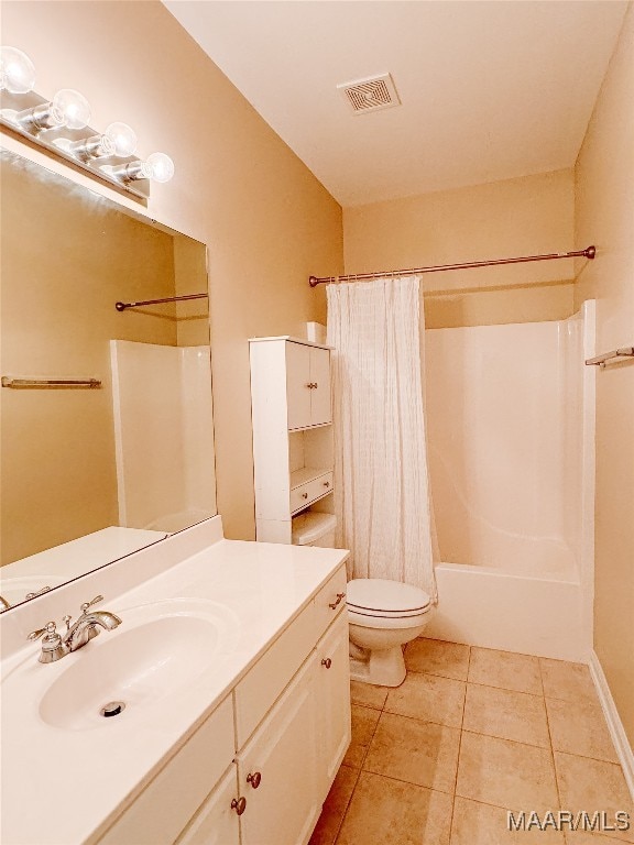 full bathroom with tile patterned flooring, vanity, toilet, and shower / bath combo