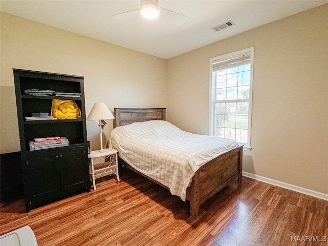 bedroom featuring ceiling fan and hardwood / wood-style flooring