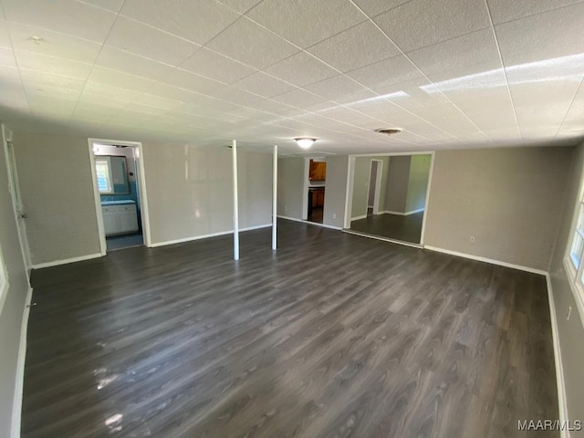 unfurnished room with dark wood-type flooring