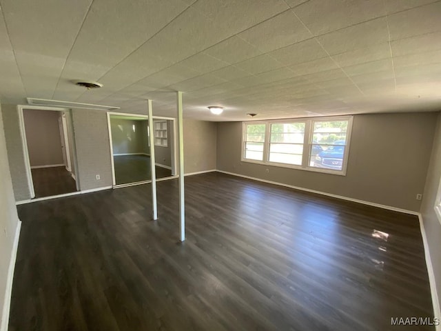 interior space with a closet and dark hardwood / wood-style floors