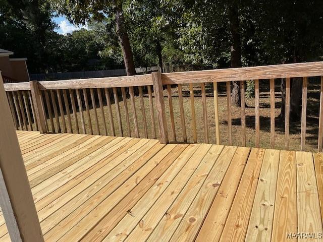 wooden deck featuring fence