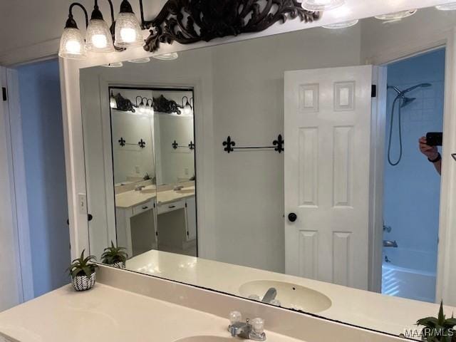 bathroom featuring shower / bath combination and vanity