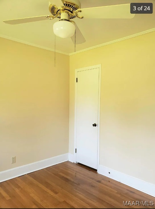 empty room featuring ceiling fan, crown molding, and wood-type flooring