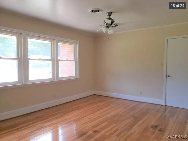 unfurnished room featuring light wood-type flooring, ornamental molding, and ceiling fan