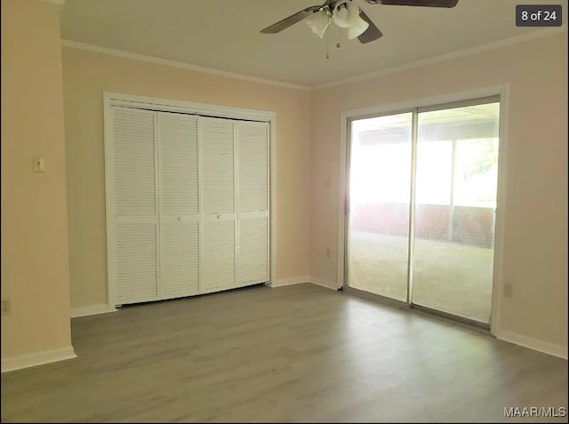 unfurnished bedroom with ornamental molding, ceiling fan, light hardwood / wood-style flooring, and a closet