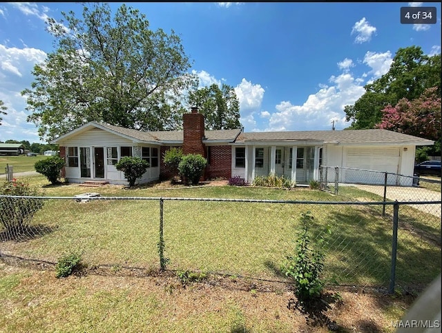 single story home with a front lawn and a garage