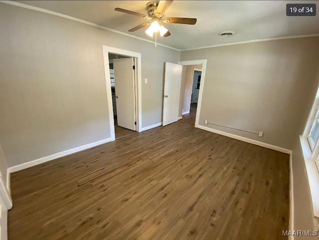 unfurnished bedroom featuring ceiling fan, dark hardwood / wood-style floors, and crown molding