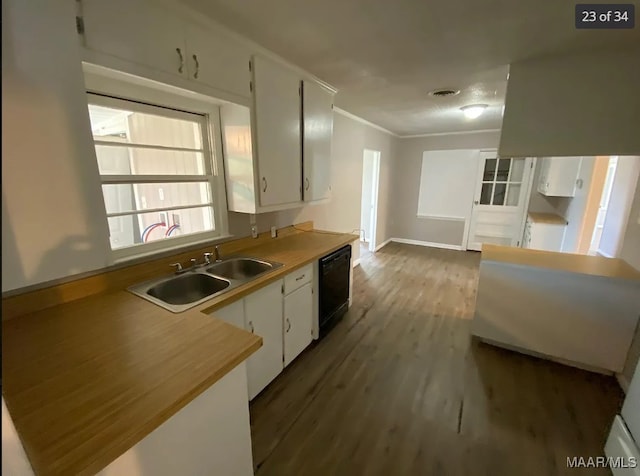 kitchen featuring white cabinetry, dishwasher, dark hardwood / wood-style flooring, ornamental molding, and sink