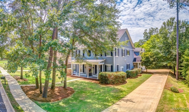 view of front of house with a front lawn and covered porch