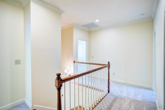 hallway with carpet flooring and crown molding