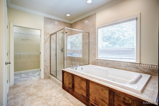 bathroom featuring crown molding and shower with separate bathtub