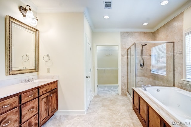 bathroom featuring plus walk in shower, plenty of natural light, and vanity