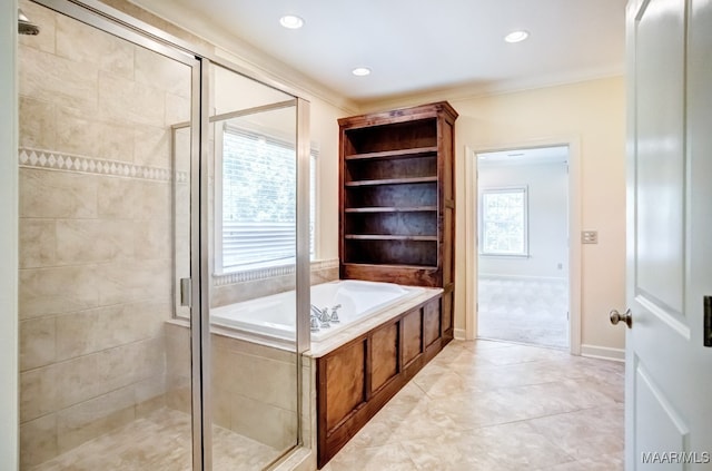 bathroom featuring crown molding and shower with separate bathtub