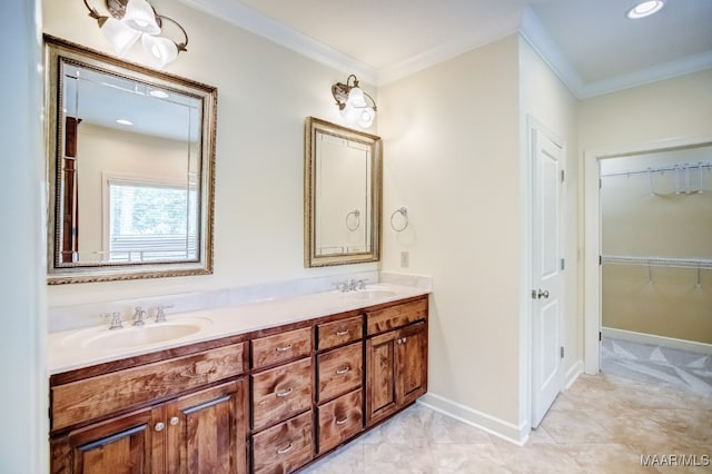 bathroom with crown molding and vanity