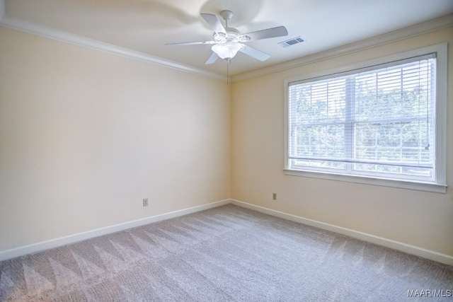 carpeted empty room with ornamental molding and ceiling fan