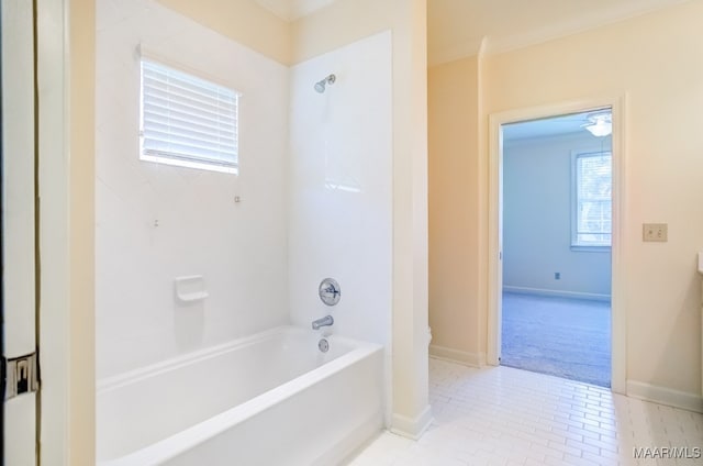 bathroom with tiled shower / bath combo and tile patterned flooring