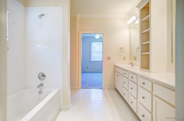 bathroom with bathtub / shower combination, tile patterned flooring, crown molding, and vanity