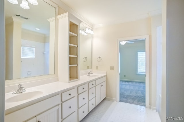 bathroom with crown molding, vanity, and tile patterned floors