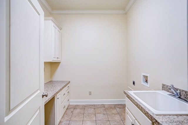 clothes washing area featuring ornamental molding, hookup for an electric dryer, sink, and washer hookup