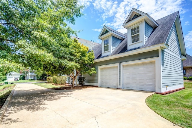 view of home's exterior with a garage and a lawn