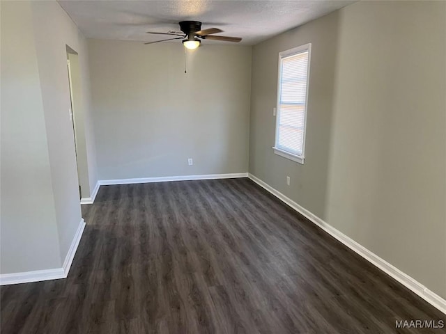 unfurnished room with a textured ceiling, dark hardwood / wood-style floors, and ceiling fan