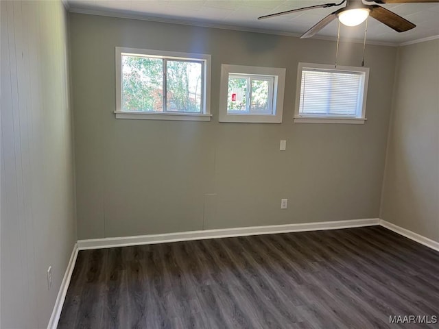 spare room featuring crown molding, ceiling fan, and dark hardwood / wood-style flooring