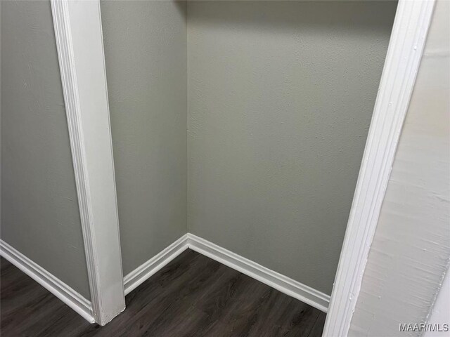 washroom with dark hardwood / wood-style floors