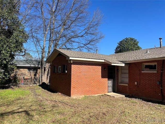 view of property exterior featuring a lawn