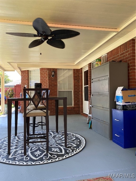 exterior space featuring ceiling fan