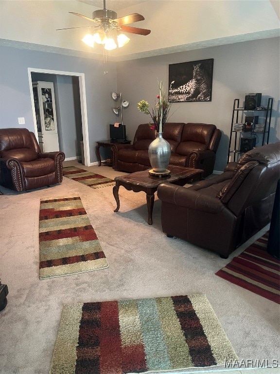 carpeted living room featuring ceiling fan