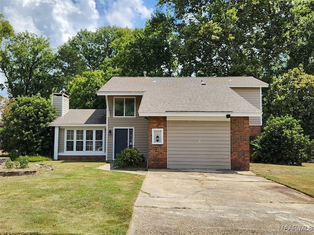 view of front of home featuring a garage and a front lawn