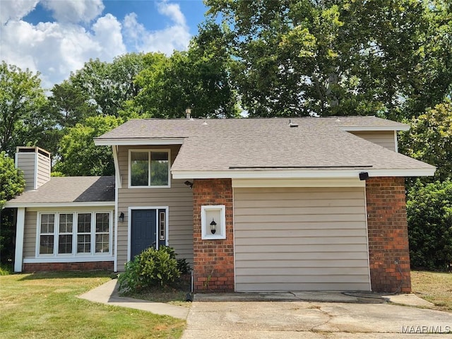 view of front facade featuring concrete driveway, a front yard, a garage, brick siding, and a chimney