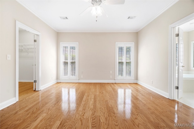 unfurnished bedroom with multiple windows, ceiling fan, and light hardwood / wood-style floors