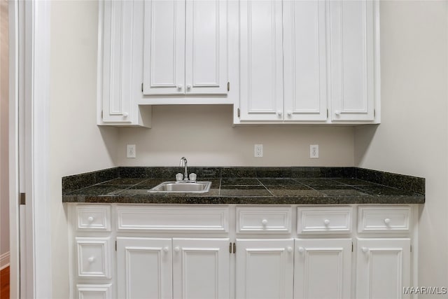 kitchen with sink and white cabinetry