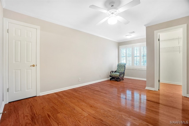 unfurnished bedroom featuring crown molding, light hardwood / wood-style flooring, and ceiling fan