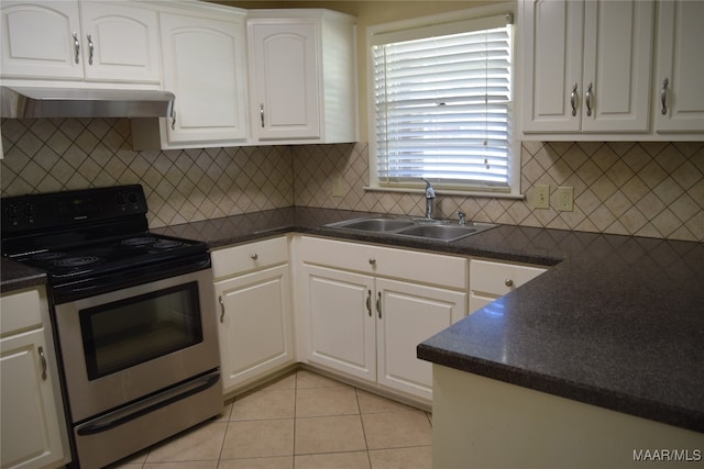 kitchen with electric range, sink, white cabinetry, and tasteful backsplash